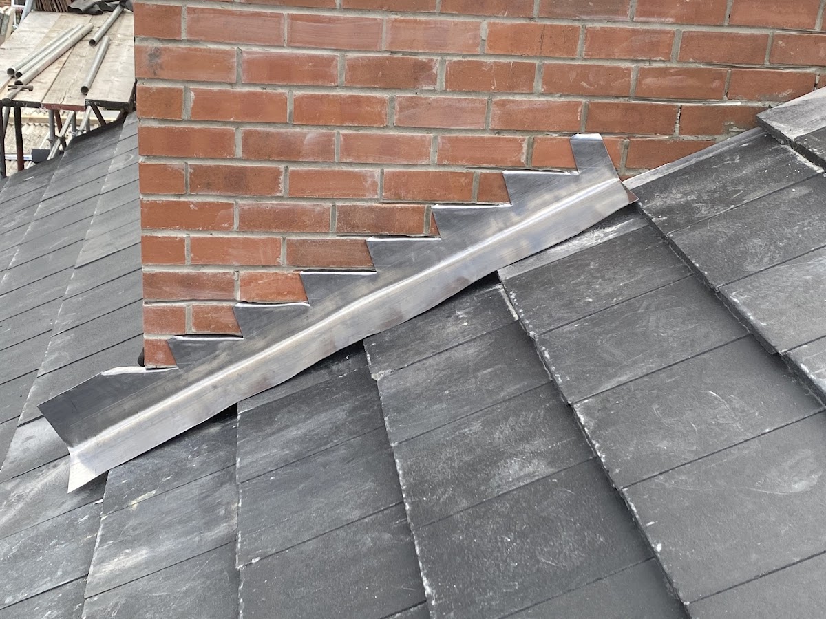 New lead stepped flashing to a brick chimney